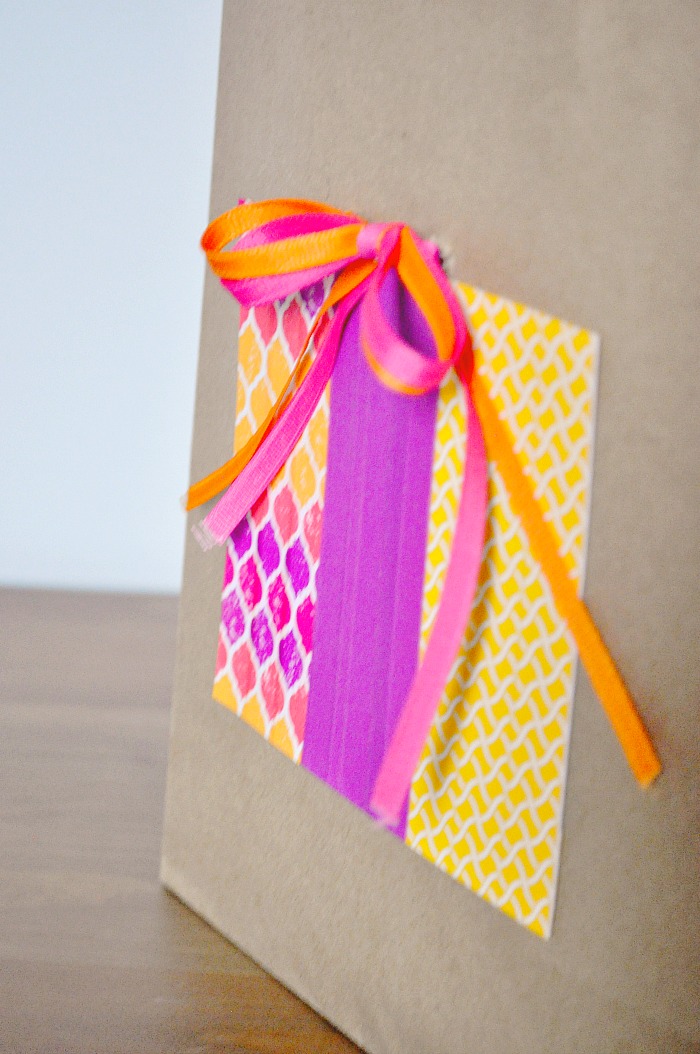 DIY Kraft Birthday Bag - Save some money by adding a splash of color to an inexpensive kraft bag! {The Love Nerds} #birthdaygift #giftwrapping #crafts