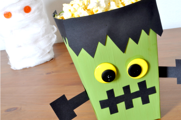 Creating fun Halloween decor and party favor boxes is easy and inexpensive! Come see how I made this fun Frankenstein Monster Popcorn Box and his friend the Mummy! {The Love Nerds} 