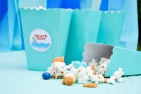 Throwing an ocean themed party? You will definitely want to include this Ocean Party Popcorn mix we made as a Shark Party Snack. It's the perfect sweet and salty snack mix that everyone will love! | The Love Nerds