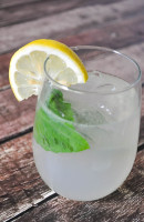 Basil Lemonade Cocktail - A fresh summer cocktail that offers a fun twist on lemonade. Can easily be made as a mocktail for the whole family. | The Love Nerds