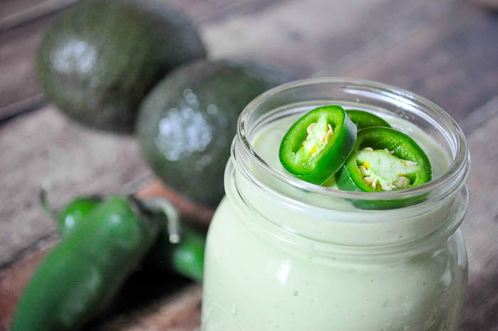 Delicious and Creamy Jalapeno and Avocado Greek Yogurt Dressing - Perfect for salads, burrito bowls, and chicken wraps! | The Love Nerds