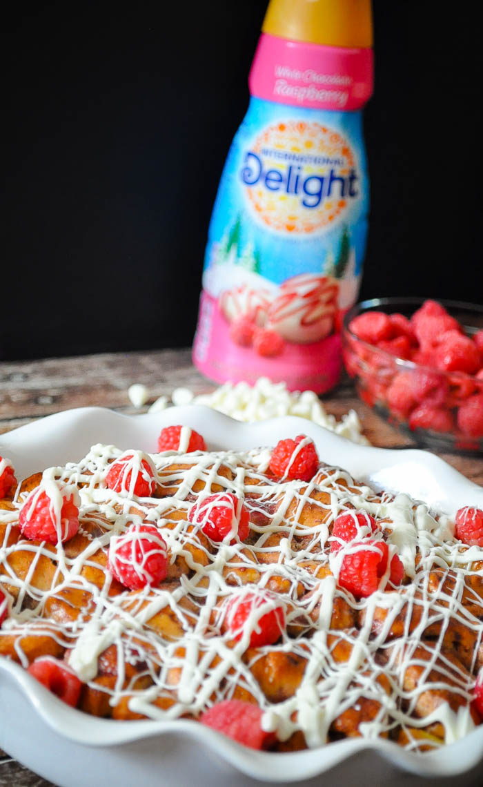This White Chocolate Raspberry Cinnamon Roll Casserole will impress all of your guests but only take you 15 minutes of prep time! | The Love Nerds #ad #FestiveFlavors