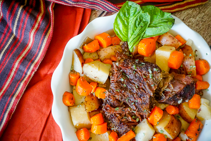 Slow Cooker Pot Roast - A savory and hearty crock pot recipe that is perfect for a cold winter night! | The Love Nerds