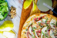 Spinach Pear Prosciutto Pizza with Honey and Walnuts is my favorite flatbread recipe so far! It's easy to make but will make quite the impression! | The Love Nerds