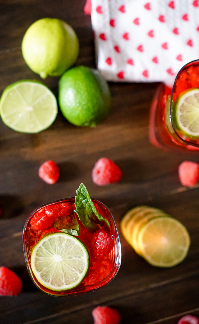Razzle Red Raspberry Mojito {With or Without Alcohol} - Perfect flavor combination of raspberry, lime and mint in a gorgeous red color. | The Love Nerds
