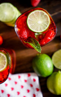 Razzle Red Raspberry Mojito {With or Without Alcohol} - Perfect flavor combination of raspberry, lime and mint in a gorgeous red color. | The Love Nerds