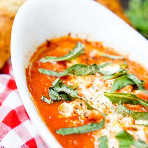 My favorite restaurant appetizer can now be enjoyed at home with only a few ingredients - Baked Goat Cheese Marinara Dip! This warm, cheesy dip recipe is a huge fan favorite! | The Love Nerds