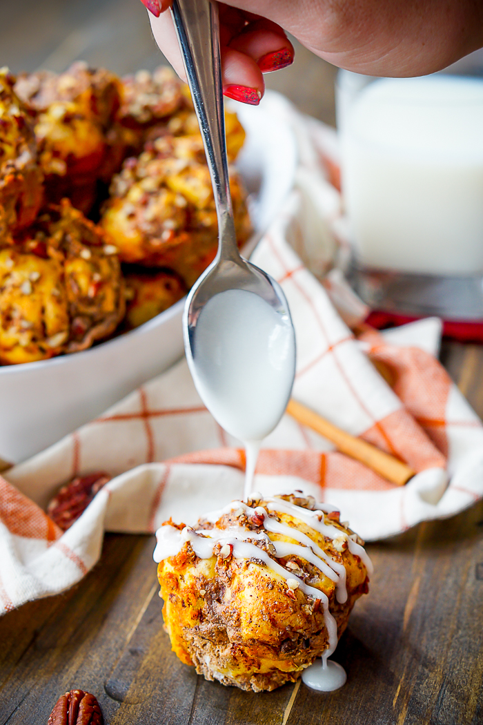 Pull Apart Pumpkin Cinnamon Roll Muffins are perfect for a fall brunch and holiday recipe! Best part? It's an easy breakfast recipe to toss together. | The Love Nerds