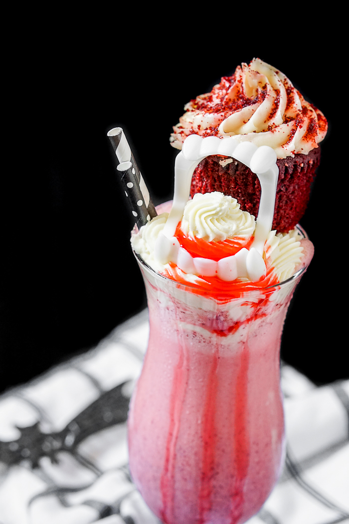Dracula's Bloody Red Velvet Milkshake is a perfect Halloween dessert but you should definitely enjoy this milkshake recipe all year long! | The Love Nerds