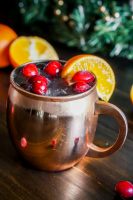 Cranberry Tangerine Lemonade Moscow Mule Recipe - Drink happy and festive with this cranberry citrus cocktail recipe using Tropicana® Tangerine Lemonade! | The Love Nerds #sponsored