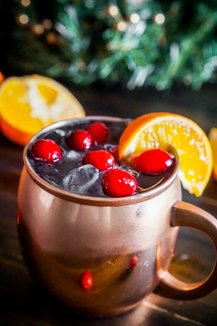 Cranberry Tangerine Lemonade Moscow Mule Recipe - Drink happy and festive with this cranberry citrus cocktail recipe using Tropicana® Tangerine Lemonade! | The Love Nerds #sponsored 
