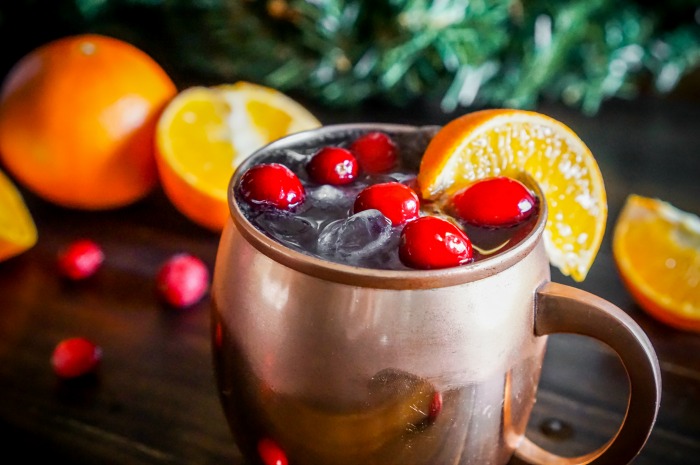 Cranberry Tangerine Lemonade Moscow Mule Recipe - Drink happy and festive with this cranberry citrus cocktail recipe using Tropicana® Tangerine Lemonade! | The Love Nerds #sponsored 