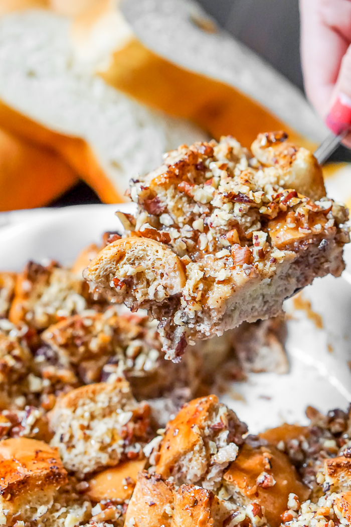 Pecan Pie French Toast Bake is warm, nutty, and holiday perfection! This brunch recipe will make you happy with every single bite! | The Love Nerds