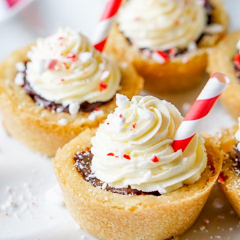 Peppermint Hot Chocolate Cookie Cups are a bite of holiday perfection! Serve up these adorable Christmas Cookies at your next holiday party. | The Love Nerds
