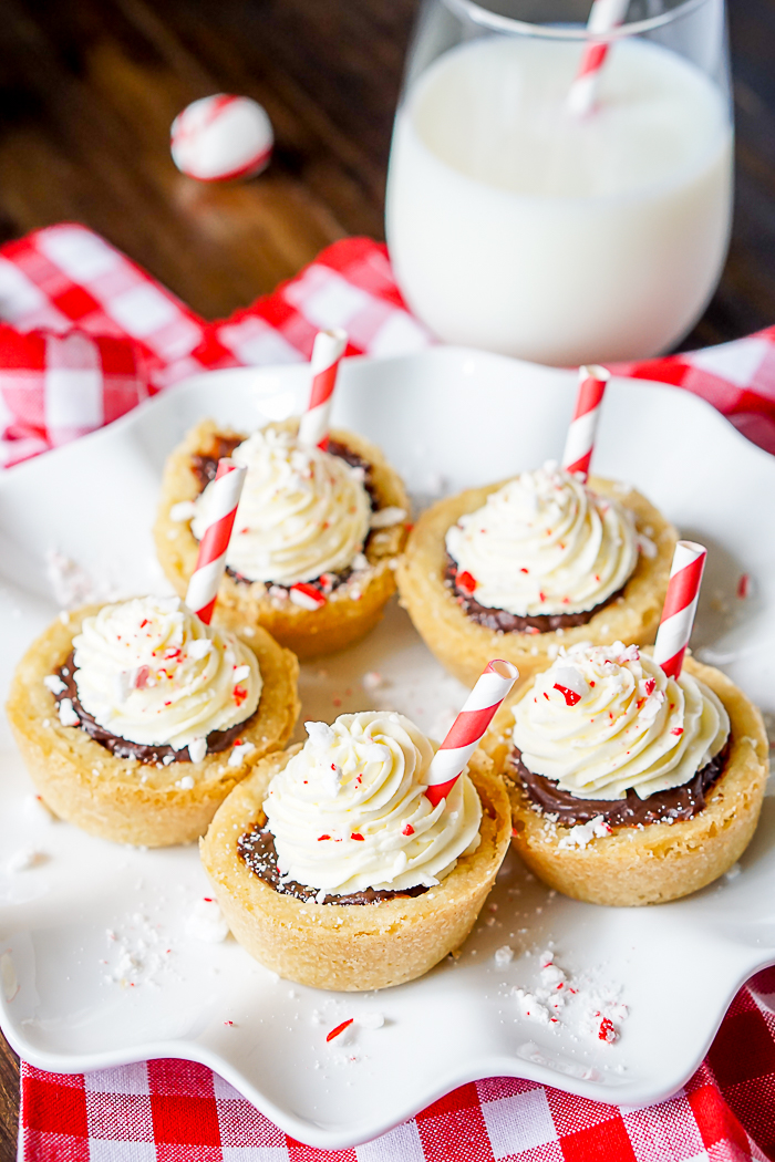 Peppermint Hot Chocolate Sugar Cookie Cups - Bring the classic holiday drink hot cocoa to your Christmas Cookie Tray! Easy Chocolate Ganache Recipe makes a decadent filling you'll love! 