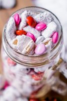 Chocolate Covered Strawberry Puppy Chow - Improve your Muddy Buddies game with the perfect Chocolate and Fruit Combo! It makes a great Valentine's Day Treat but it's a tasty and easy dessert all year long! | The Love Nerds