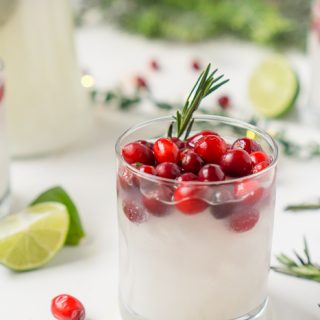 It's time for a new White Christmas cocktail! Sip on these White Cranberry Margaritas this holiday season and enjoy a smooth blend of coconut, cranberry and tequila. It's the perfect blend of summer and winter into my new favorite holiday cocktail!  | The Love Nerds #cranberrymargarita #holidaycocktail #christmasmargarita