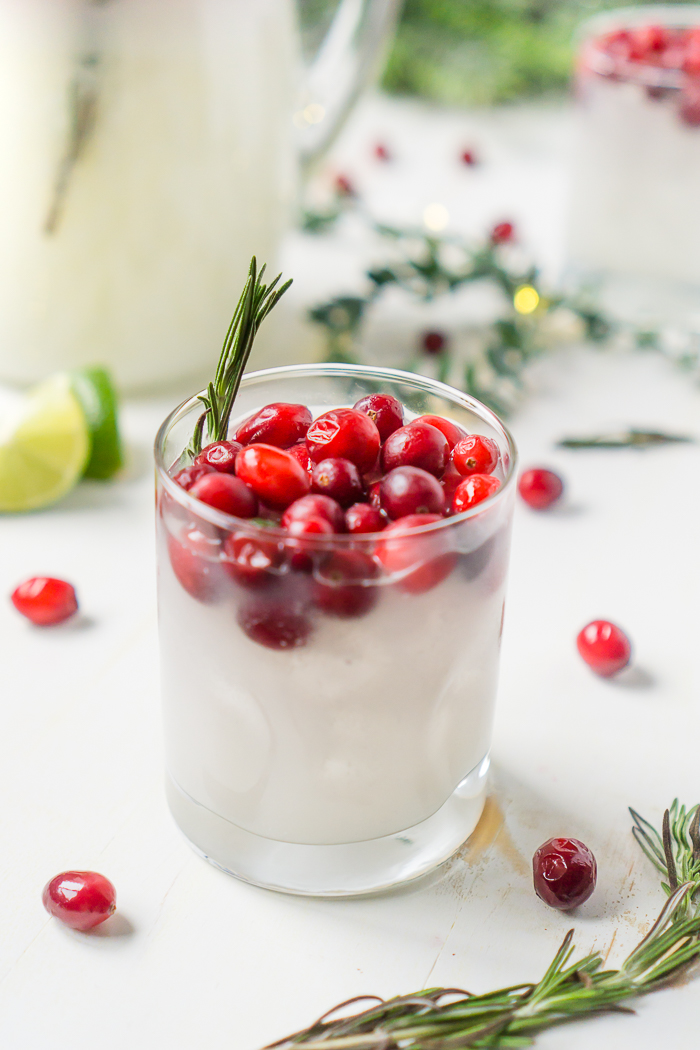 White Cranberry Margaritas with Coconut - A Festive Christmas Cocktail with Fresh Cranberries and Rosemary Garnish