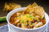 Make a super easy chicken tortilla soup in your slow cooker with less than 10 minutes of prep work! It's the only chicken tortilla recipe you'll need and makes dinner prep even easier with the ability to cook extra chicken with the coup for other meals during the week. Hearty, flavorful, and full of chicken, veggies and spices!