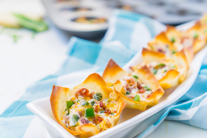All the tasty goodness of Bacon Jalapeno Poppers inside an easy baked wonton cup! These bite size poppers make the perfect appetizer for your next party or game day celebration. You're friends and family will love them!