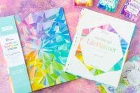 Erin Condren Life Planner Binder in colorful kaleidoscope design with the inside calendar filling sitting to the right of the binder