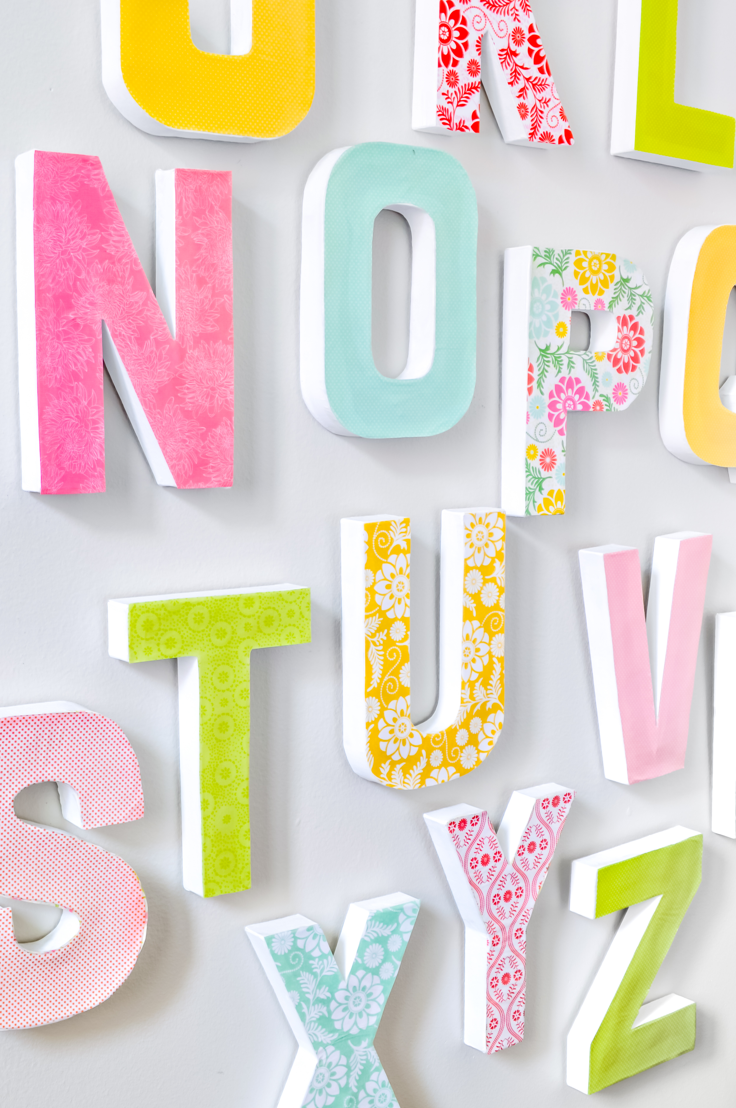 Make a Big Impact in your Home Decor with these DIY Wall Letters! These decorative paper mache or wood letters are easy to customize for your gallery wall, office, nursery, or playroom. 