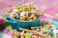 Lucky Charms Puppy Chow is a deliciously easy St Patrick's Day dessert recipe for the whole family! Kids and adults will both love this sweet and salty treat! 