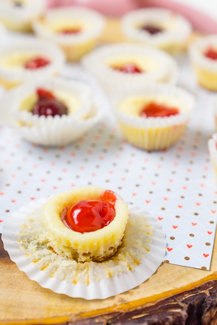 Mini Cheesecake Bites with Nilla Wafer Crusts are easy to make and delicious with a creamy filling and flavorful fruit topping! It’s the perfect party dessert, making a large batch that you can customize with different toppings in the same mini cupcake pan! 