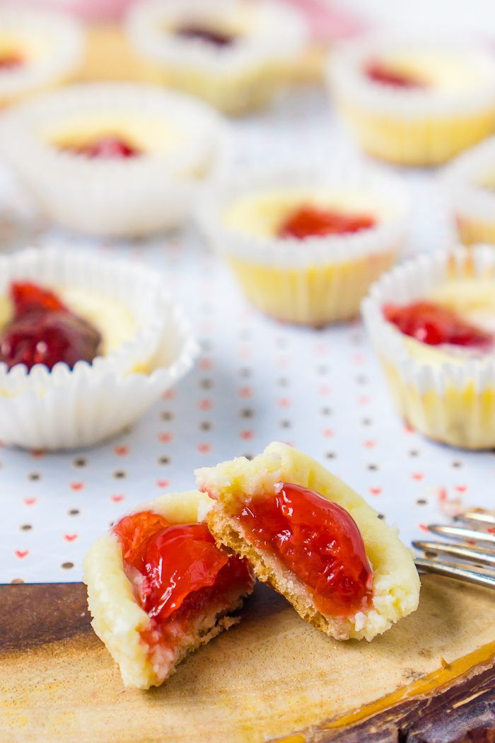 This recipe for Mini Cheesecakes with Vanilla Wafers is a family favorite dessert recipe! Only 15 minutes of prep yields a large batch of these cheesecake bites, making it perfect for a party menu or holiday party. A cherry or strawberry topping makes them perfect as a Valentine’s Day treat! 
