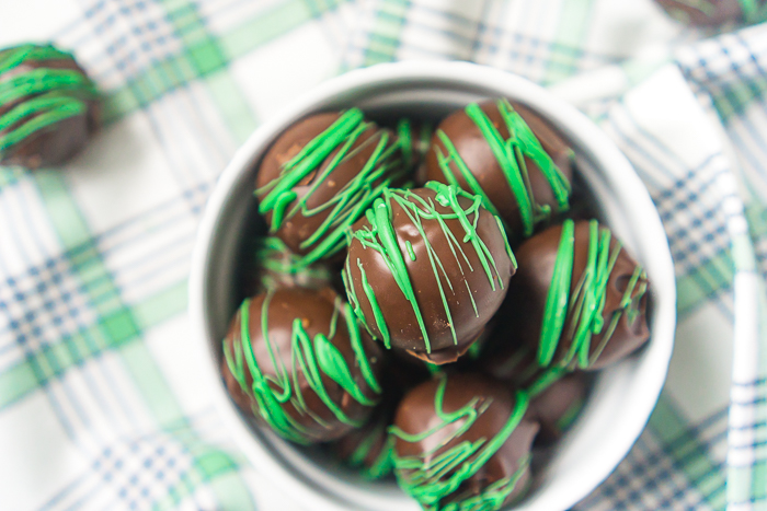 These Mint Chocolate Truffles using Grasshopper or Thin Mint cookies are addicting! While you'll want to enjoy these all year long, they make the perfect easy St. Patrick's Day dessert recipe! Creamy, flavorful and only 3 ingredients! 