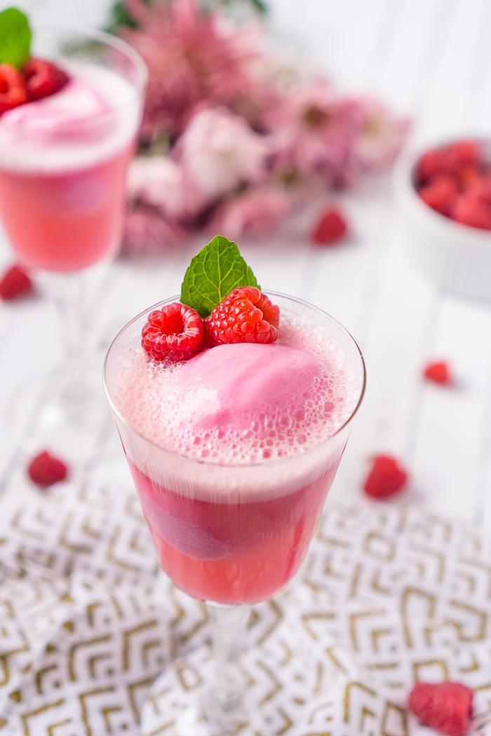 Raspberry Champagne Float is the perfect dessert recipe and cocktail recipe in one with raspberry sherbet and sparkling wine!! The perfect holiday recipe to add to your celebration! 