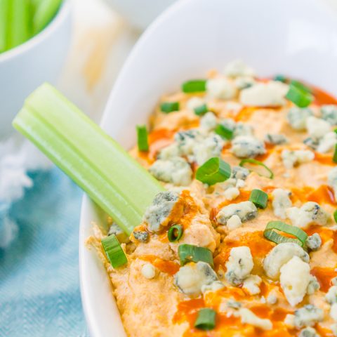 Slow Cooker Buffalo Chicken Dip - cream cheese, Greek Yogurt, Frank’s Buffalo Sauce, ranch seasoning and more all combine into an irresistible chip dip you’re guests will love! Perfect for game day!