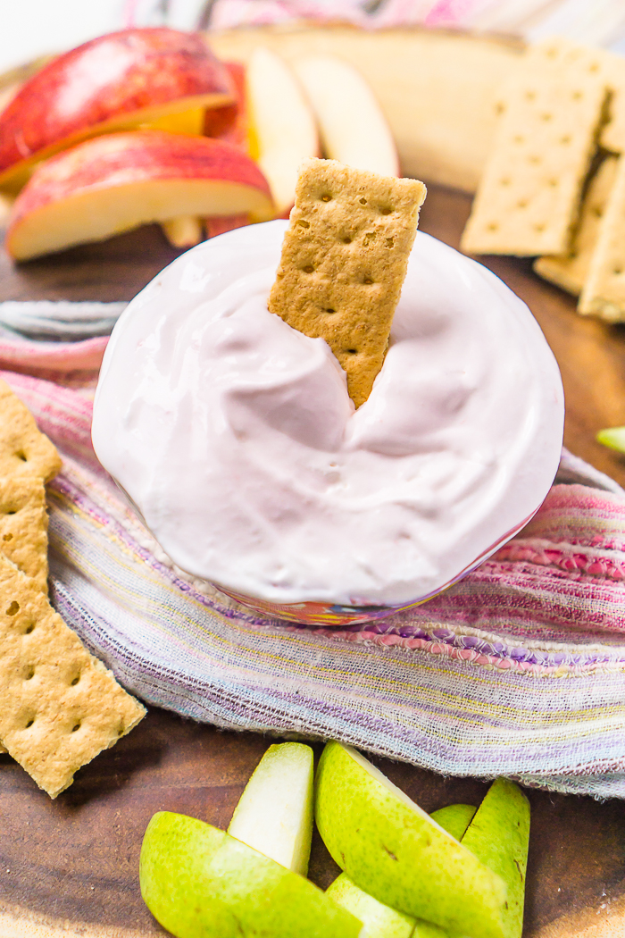Easy Strawberry Fruit Dip with Cool Whip and Yogurt! Easy to make and a delicious pairing with Strawberries, grapes, apples, graham crackers and more! 