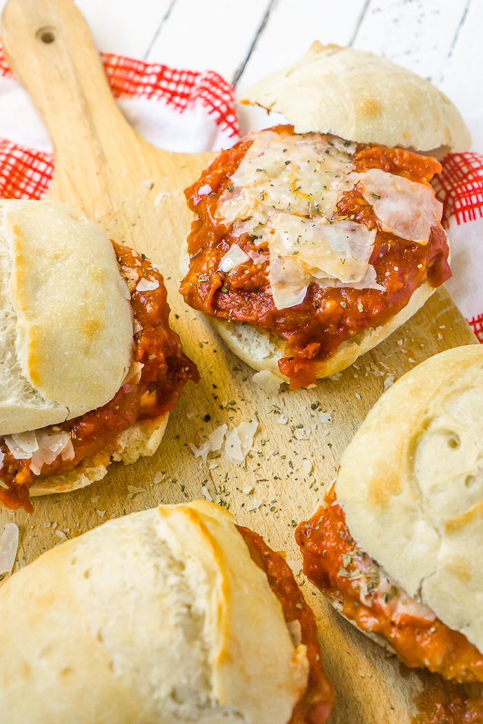 Chicken Parmesan Sliders are an easy dinner recipe that you're whole family will love! White meat chicken, fresh mozzarella, and savory tomato sauce on top of fresh rolls make delicious sandwiches that requires less than 5 ingredients and less than 15 minutes of prep work! 