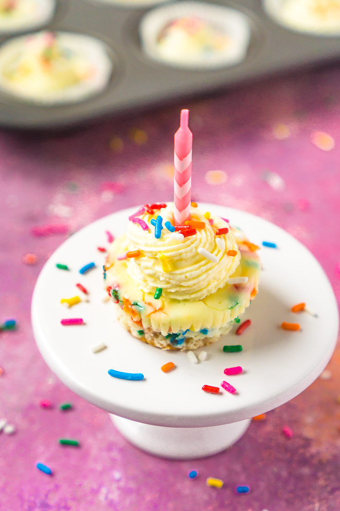 Switch up your birthday cake choice with these adorable and colorful Mini Funfetti Cheesecakes! A sprinkle filled funfetti filling on top of an easy vanilla wafer crust! 
