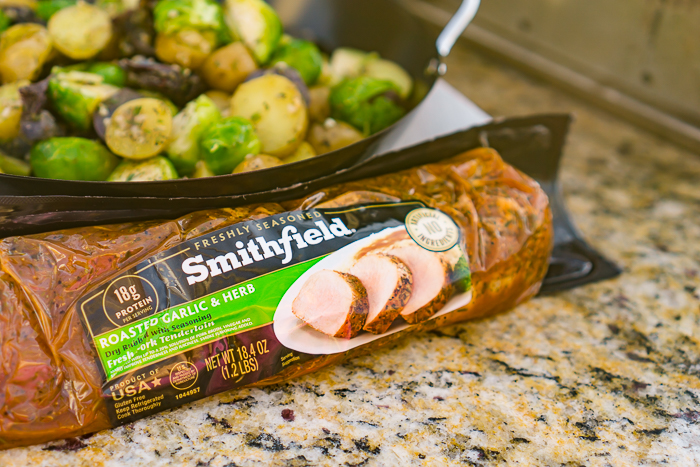 Make this easy dinner on the grill this summer with Smithfield fresh pork tenderloin and grilled vegetables! These easy Garlic and Herb Grilled Potatoes and Brussels Sprouts are a new staple in the house and make the perfect companion for grilled pork! 