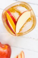 Celebrate Katniss Everdeen with this Hunger Games inspired cocktail - The Girl on Fireball Cocktail! OR just celebrate your love of perfect fall cocktail recipes and combine spiced Fireball Whiskey with tasty cider! | THE LOVE NERDS #fireballwhiskey #fallcocktail