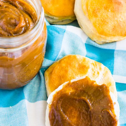 This 5 ingredient Slow Cooker Pumpkin Butter is absolutely addicting and a fall pumpkin recipe staple for us because it makes the perfect ingredient for fall baked goods, main dish recipes and even morning toast! | THE LOVE NERDS