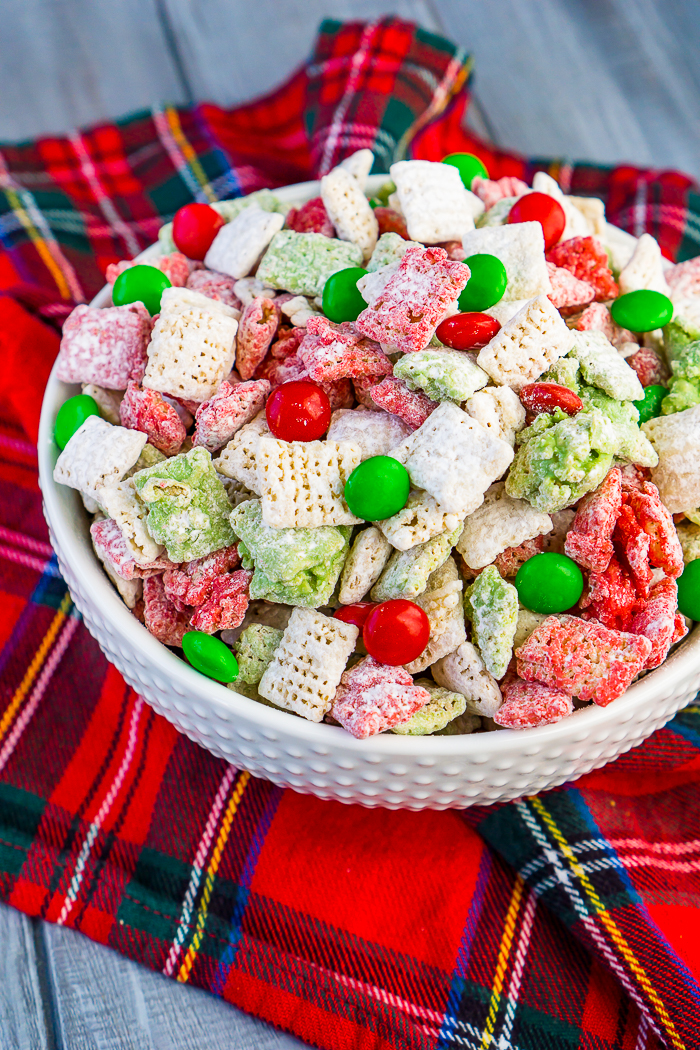 Let's not leave the reindeers out this holiday season by making them their own special Reindeer Chow {aka Christmas Puppy Chow}! This holiday party mix recipe is filled with festive white, red, and green to celebrate the season!! Perfect for your Christmas parties or gift exchanges with neighbors and friends. 