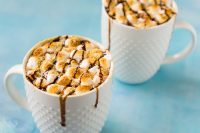 Indulge in an extra rich treat this winter season with this easy S'Mores Hot Chocolate! Rich hot chocolate topped with toasted marshmallows, graham cracker crumbs and chocolate drizzle! 