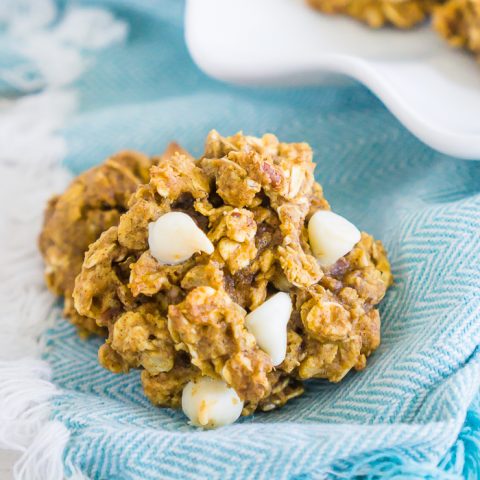 Combine the perfect fall flavors of pumpkin, oatmeal, nutmeg, and cinnamon into delicious White Chocolate Chip Pumpkin Oatmeal Cookies that are so addicting you will want them with your coffee in the morning! It will be one of your new fall pumpkin cookie favorites!