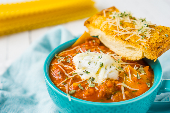 Looking for a warm new soup to add to your winter menus? Then this One Pot Lasagna Soup is for you! Full of Italian sausage, tomatoes, spinach, cheese and lasagna noodles, it has all the yummy flavors of a lasagna without all the time and work! 