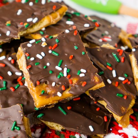 Saltine Toffee is a quick and easy Christmas Candy that is an addicting sweet and salty holiday treat! Known by many as Christmas Crack, this is a candy recipe you will definitely want to add to your holiday menu! | THE LOVE NERDS #christmascandy #christmasdessert #candyrecipe #holidayrecipe