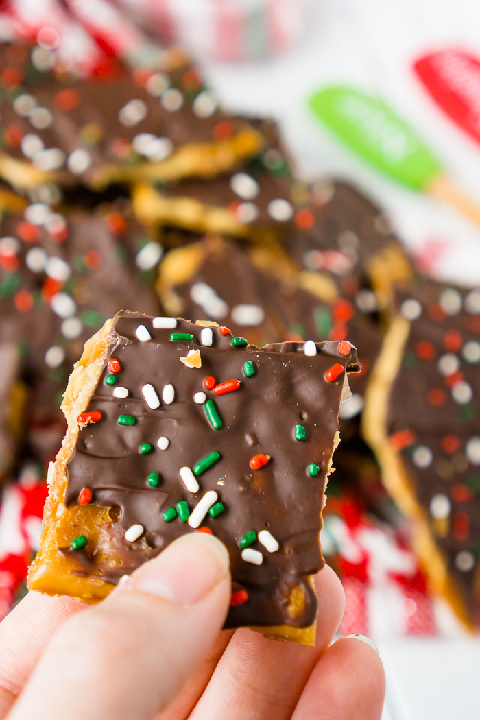 Saltine Toffee is a quick and easy Christmas Candy that is an addicting sweet and salty holiday treat! Known by many as Christmas Crack, this is a candy recipe you will definitely want to add to your holiday menu! | THE LOVE NERDS #christmascandy #christmasdessert #candyrecipe #holidayrecipe 