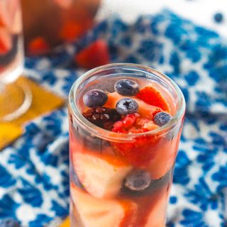 Filled with delicious summer berries, this is the BEST Summer Sangria Recipe! It's light, refreshing and so easy to make and customize all summer long. Plus, it doesn't need to sit over night making it great for summer parties!  