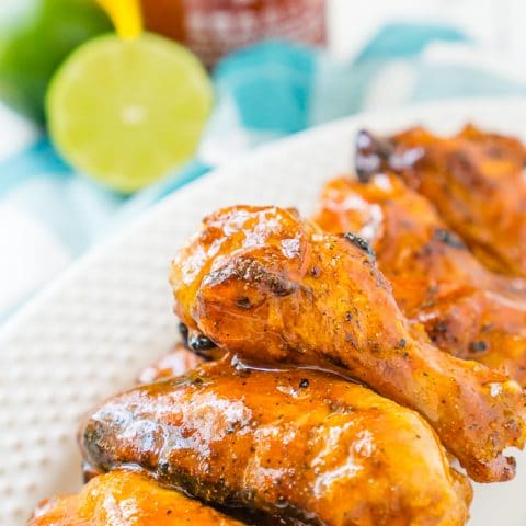 Honey Sriracha chicken wing recipe is the perfect game day recipe with a tasty combination of sweet and spicy in every single bite! They are a must make for anyone who loves a little kick to their wing sauce! | THE LOVE NERDS #chickenwingsaucerecipe #chickenwings #grilledchickenwings #bakedchickenwings